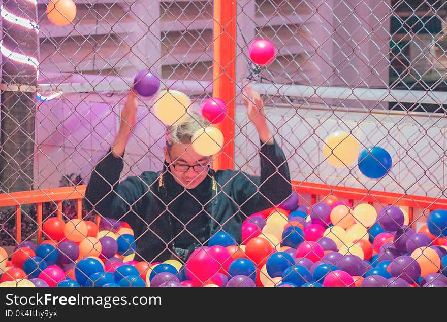 Man in Ball Pit