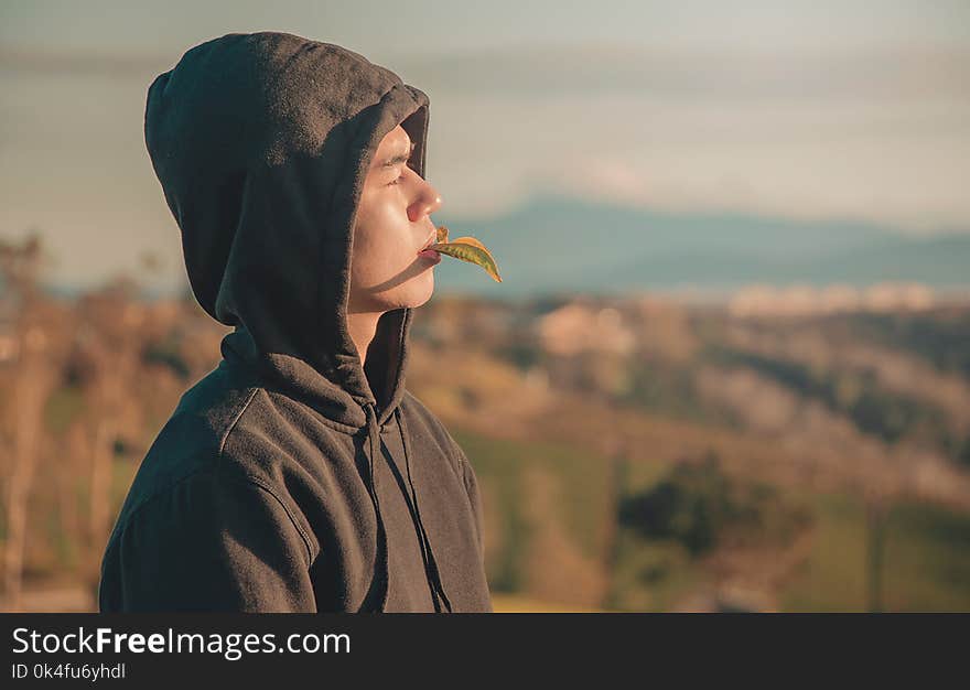 Man Wearing Black Pullover Hoodie