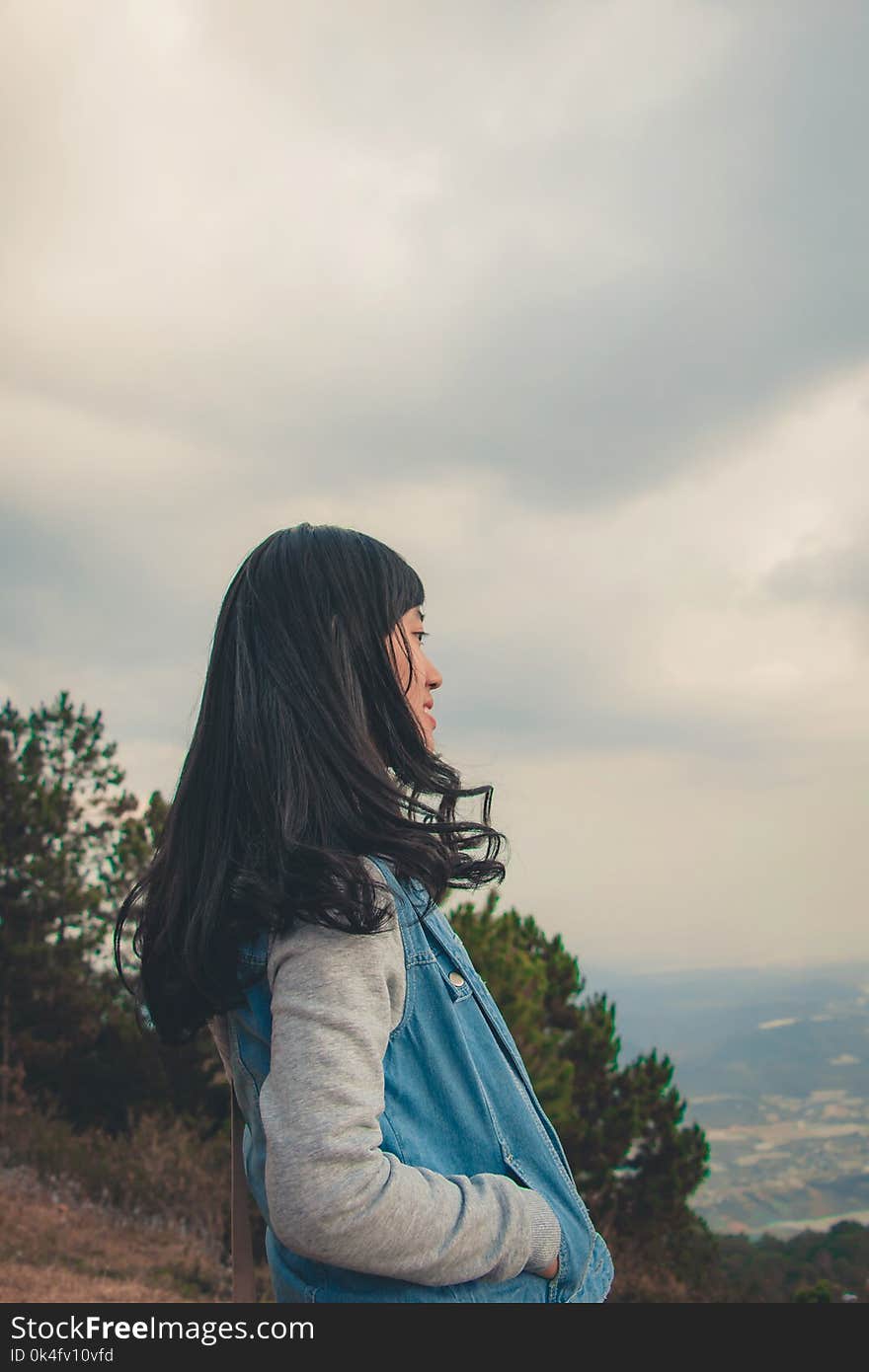 Woman in Gray and Blue Jacket