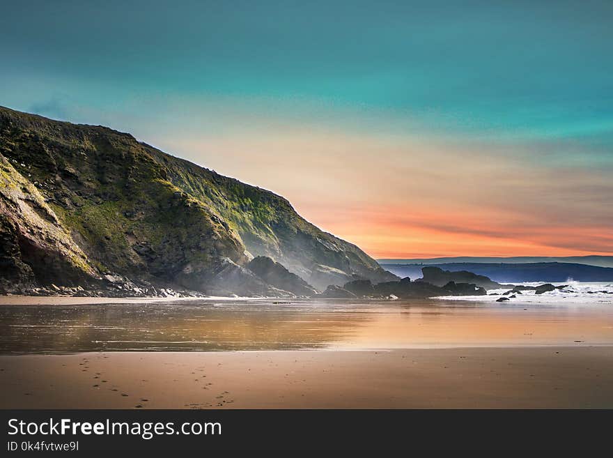 Scenic View of Beach During Dawn