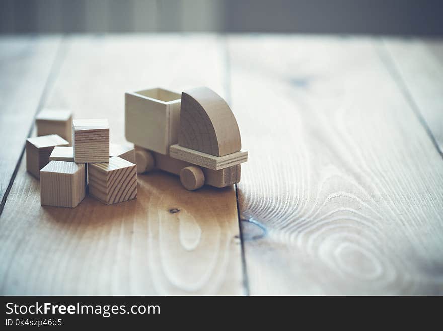 Wooden model of truck loading freight. Shipping and delivery concept