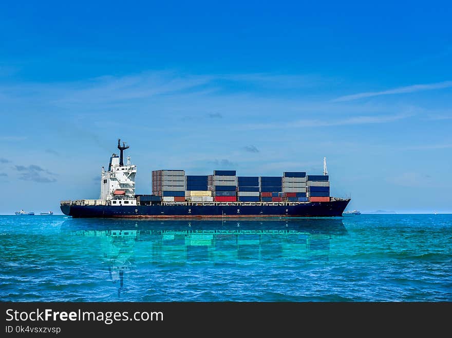 container ship in the sea on blue sky background. container ship in the sea on blue sky background