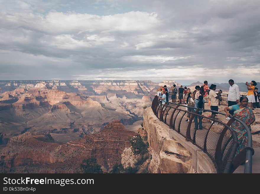 People Watching View from Top of Mountain