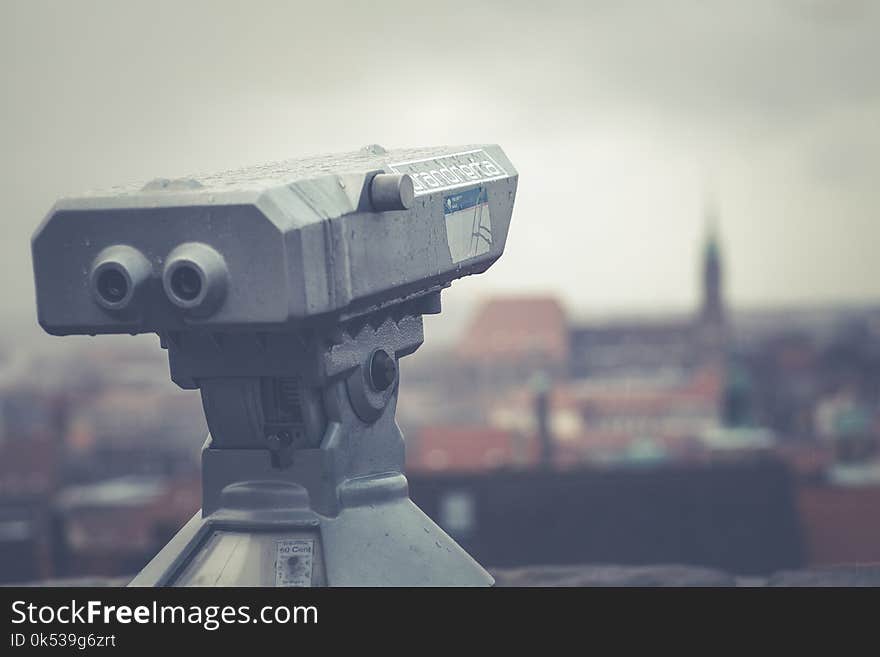 Gray Telescope Above Building