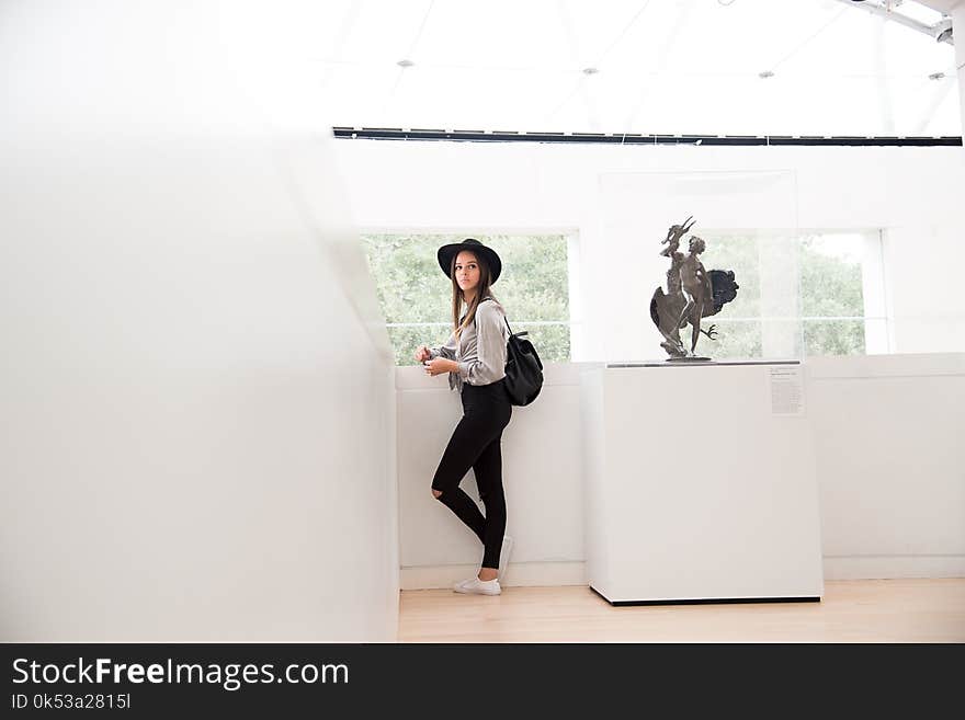 Woman Standing at the Corner