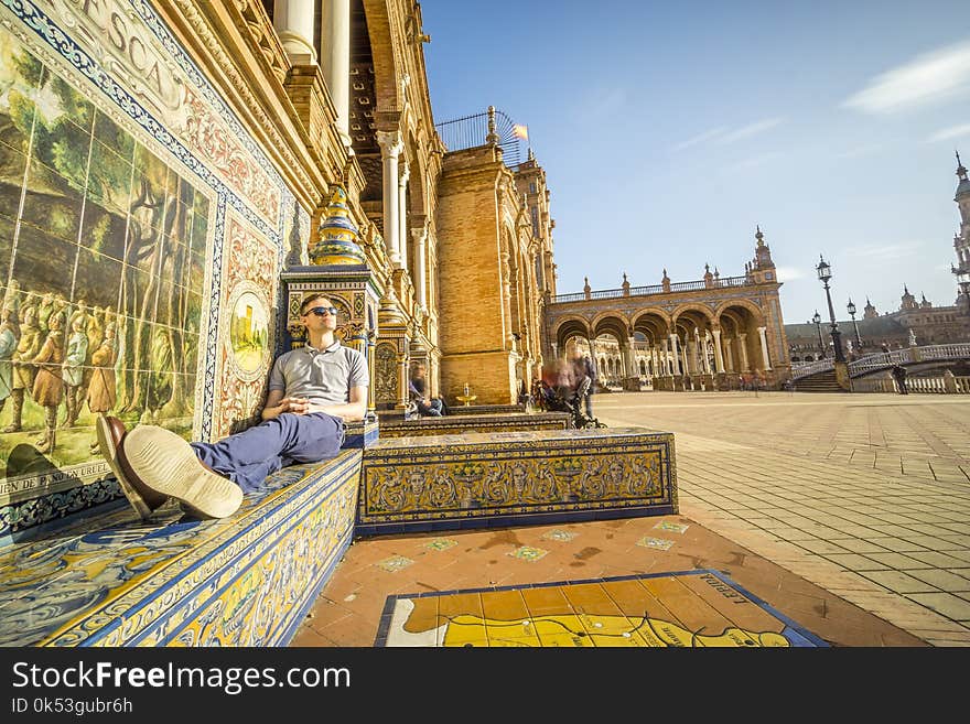 Tourist enjoying sun on Plaza de Espana, Seville, Andalusia, Spa