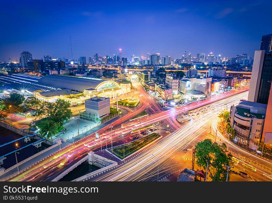 Bangkok railway station Hua Lamphong with lights of cars at twilight in Bangkok, Thailand.