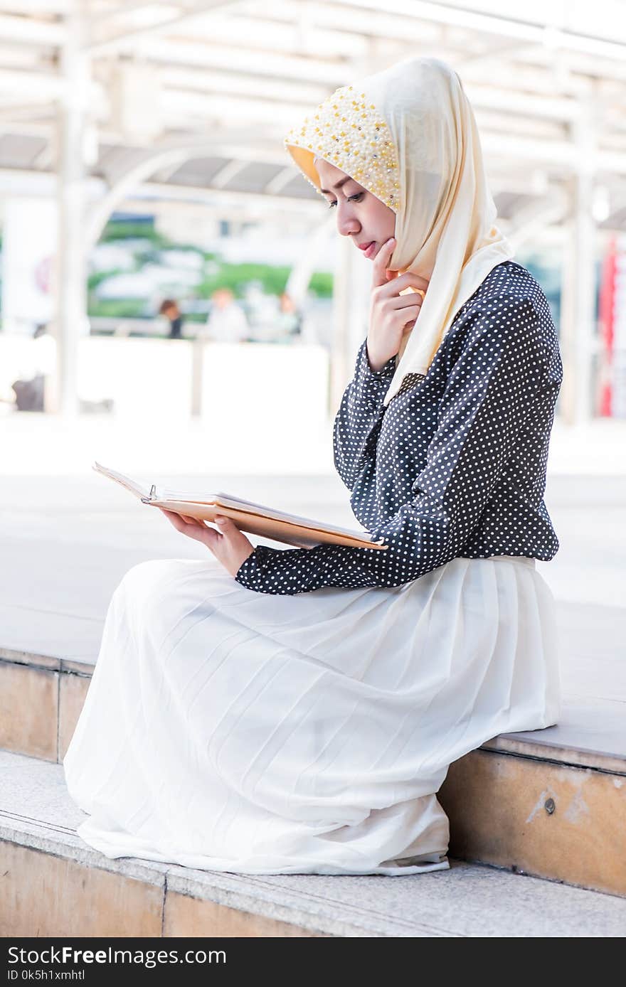 Muslim Lady Reading The Book