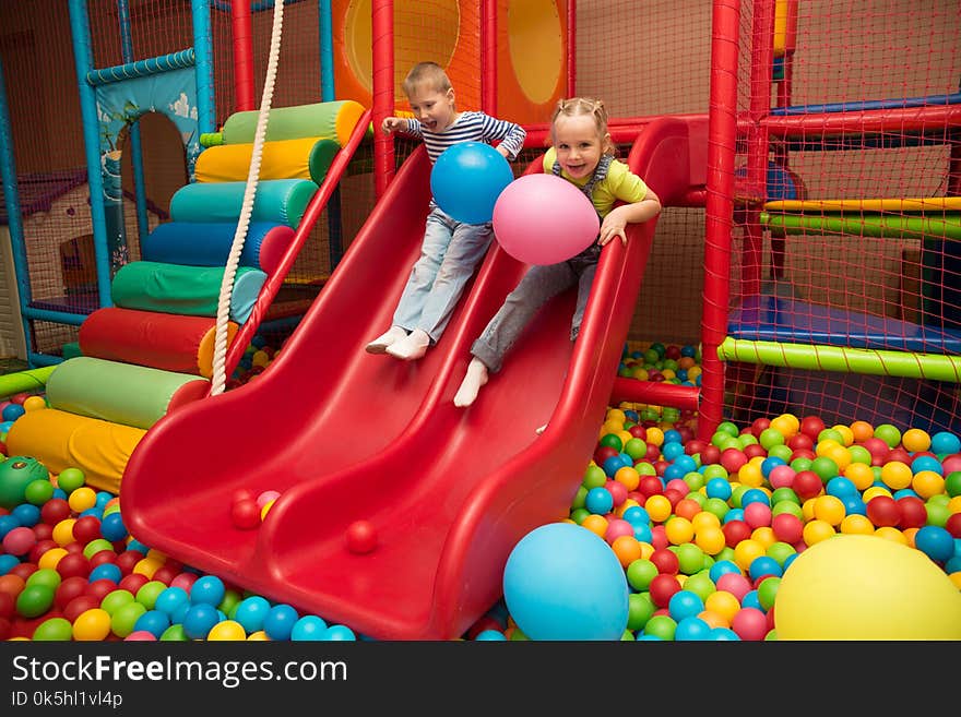 Group of kids plaing in a pool of balls. Group of kids plaing in a pool of balls