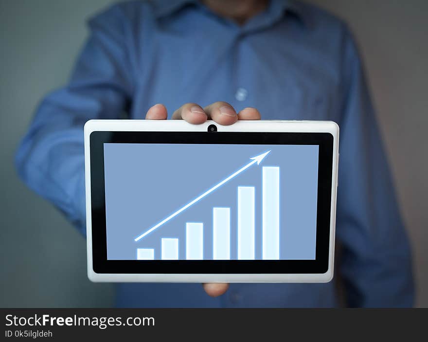 Man holding financial graph.