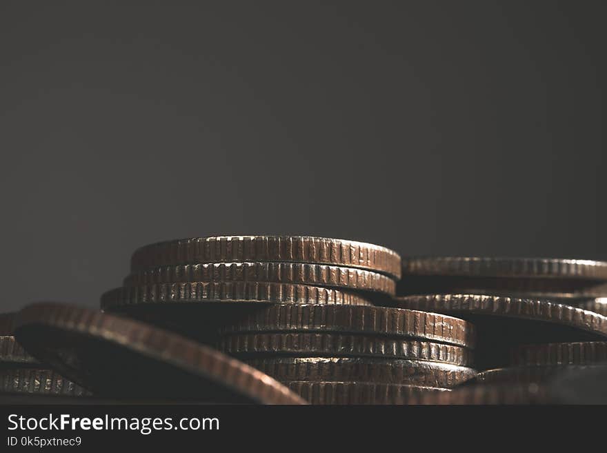 Stacks of coins in the form of a ladder on white background.