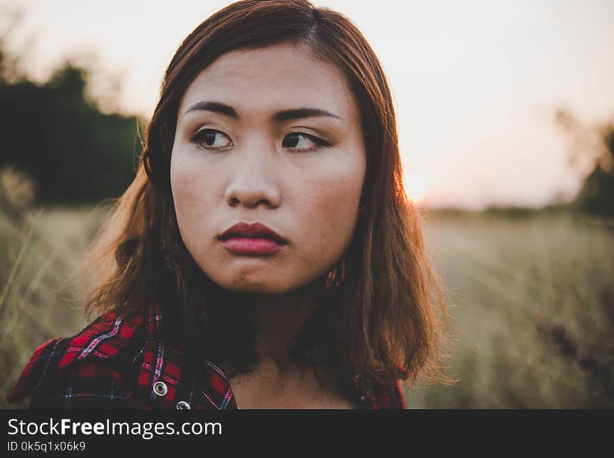 Close Up Of Beautiful Sad Young Girl In A Field. Vintage Filter