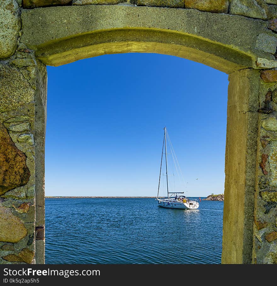 Sailboat Is Going Out Of The Port To The Open Sea