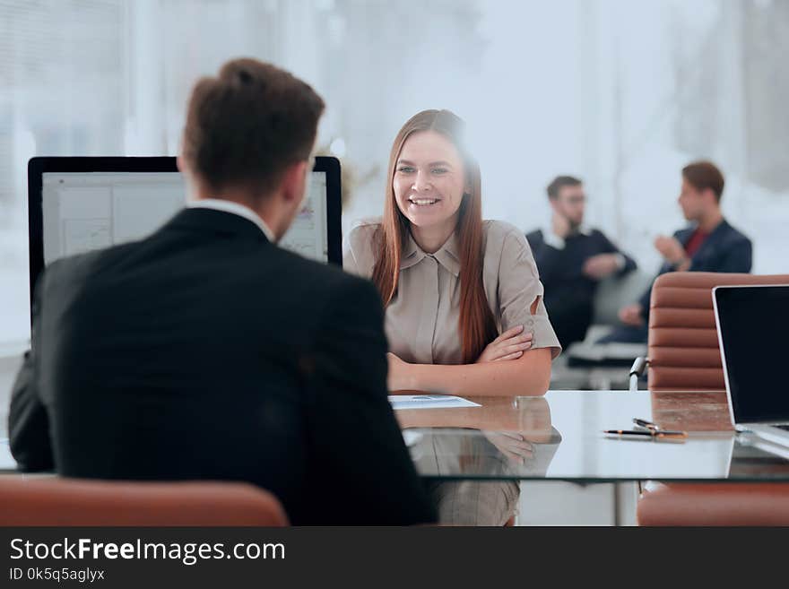 Woman working with her colleague in the office.office life