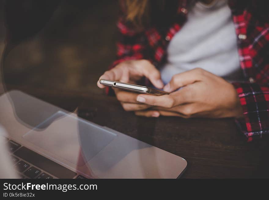 Close up of woman`s hands holding smartphone. Hipster girl with