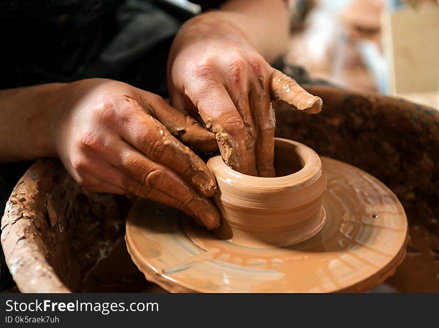 Potter at work. Workshop place.