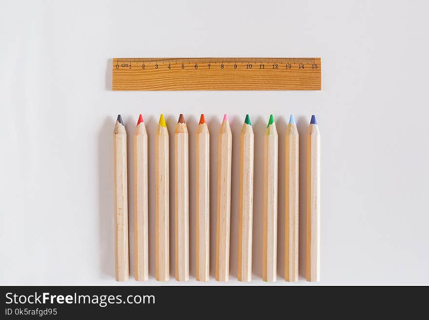 Wood ruler and pencil on the white. Wood ruler and pencil on the white