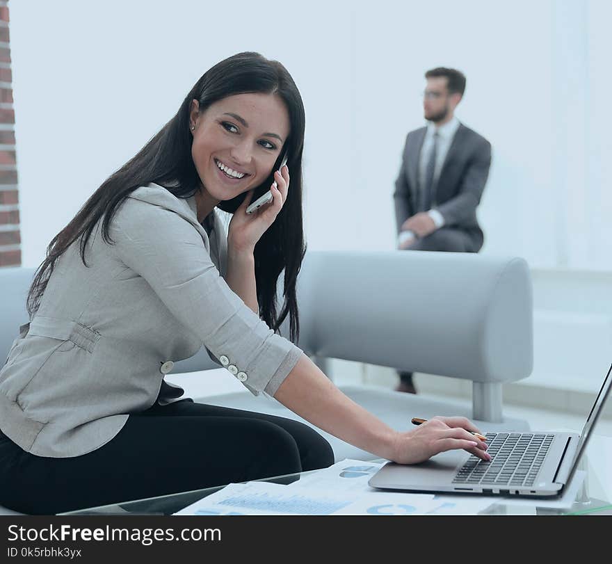 Competent women assistant at her workplace. Photo with copy space. Competent women assistant at her workplace. Photo with copy space