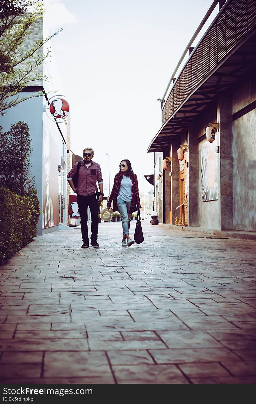 Portrait of hipster couple walking in the street urban. Couple e