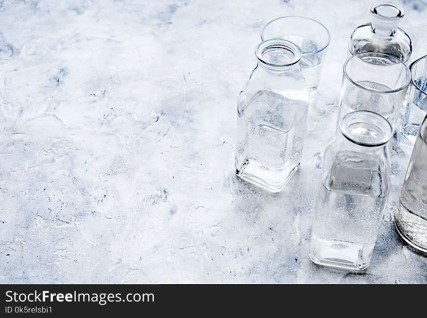 Drinks On The Table. Pure Water In Jar And Glasses On Grey Background Space For Text