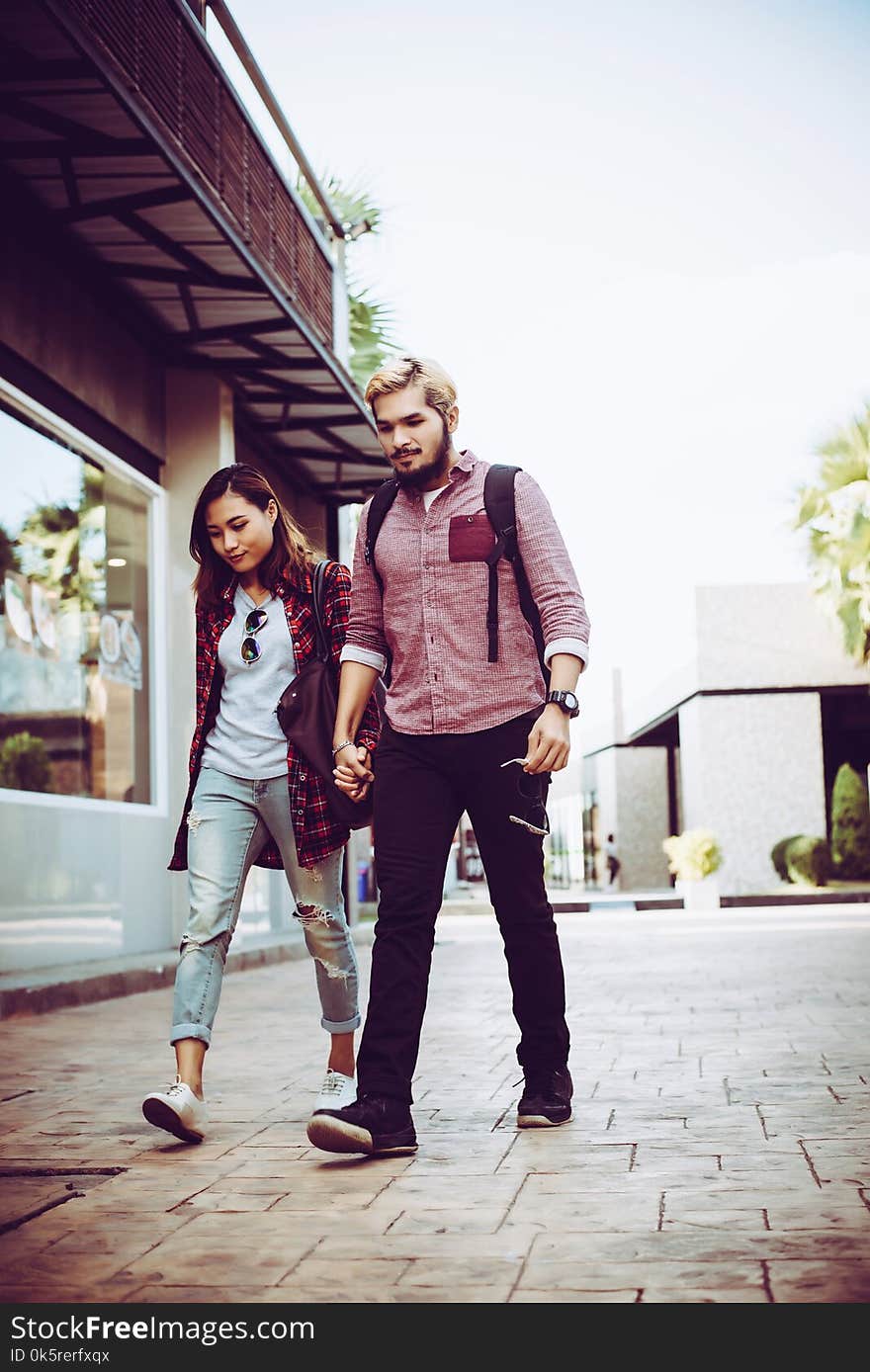 Portrait of hipster couple walking in the street urban. Couple enjoy the time together.