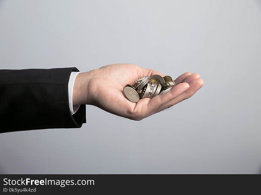 Man Holding Coins In Hand