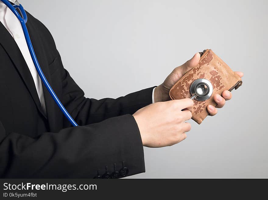 Man using stethoscope for wallet