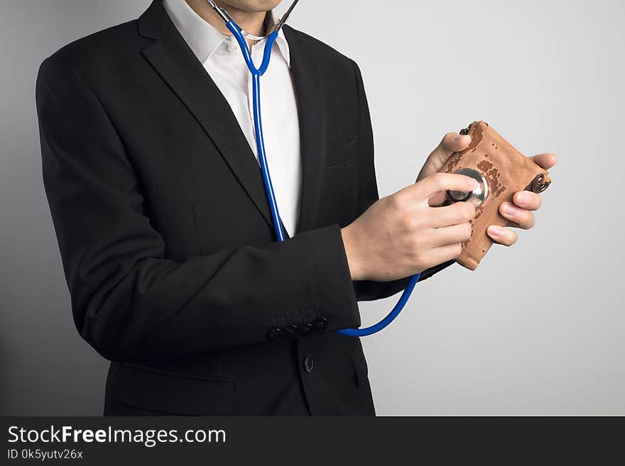 Man using stethoscope for wallet