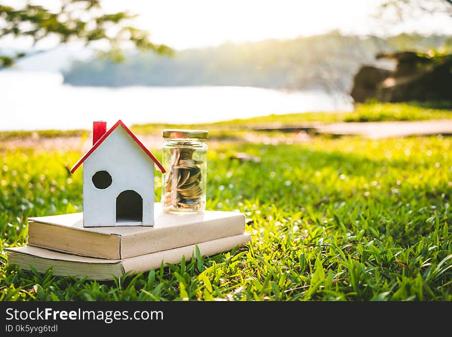 House on the grass in nature, Concept Investment in real estate finance. House on the grass in nature, Concept Investment in real estate finance.