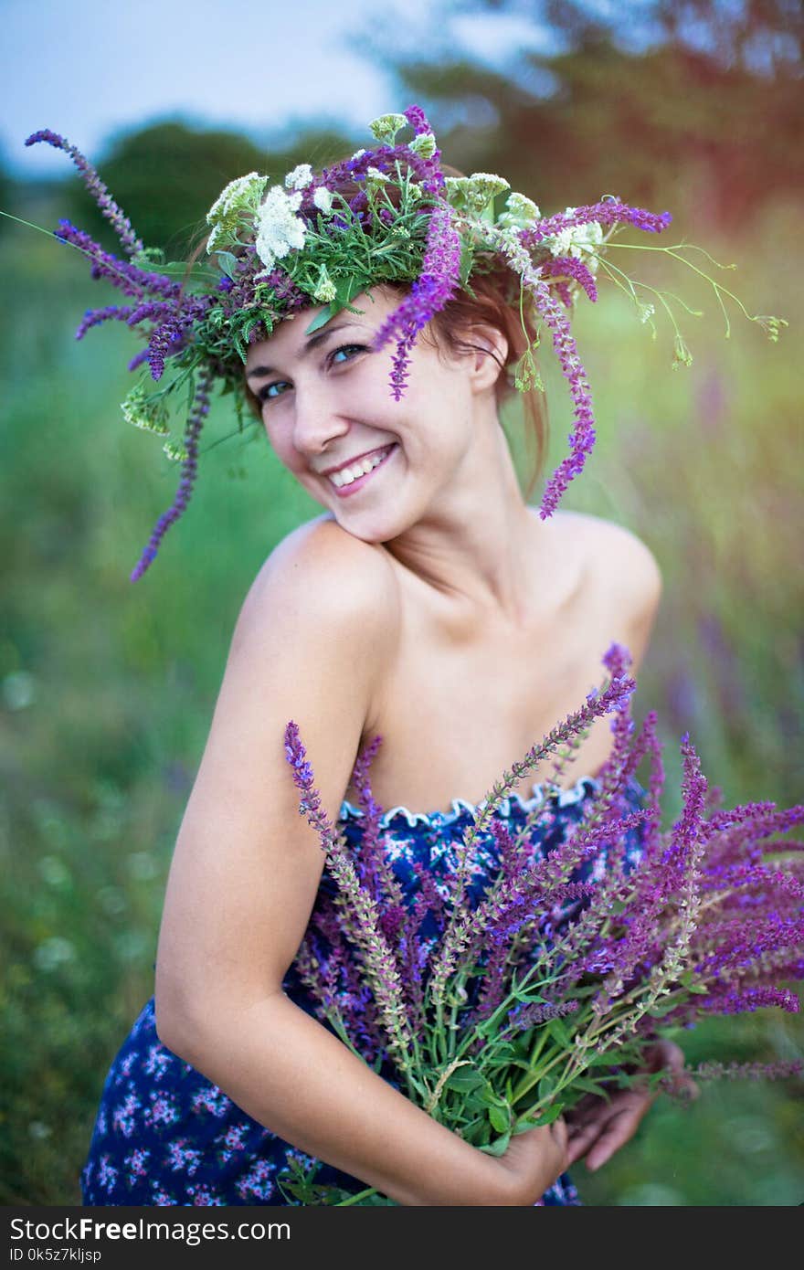 young laughing woman in a wreath