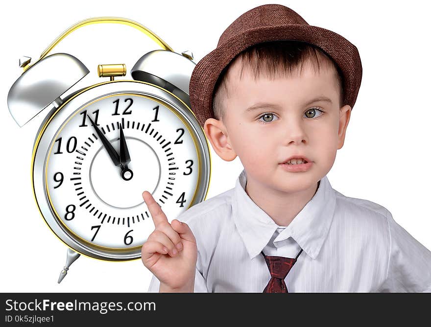 A little boy in a hat is pointing at his watch. The concept of time