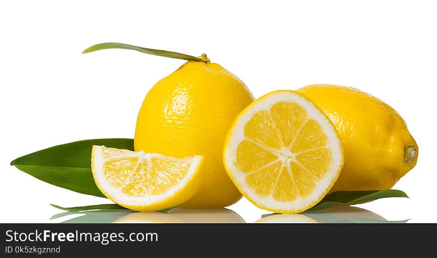 Two whole lemons with leaves and pieces isolated on white