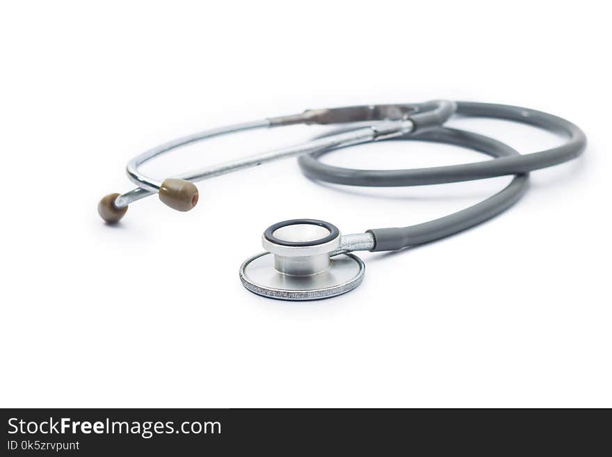 closeup old stethoscope on white background