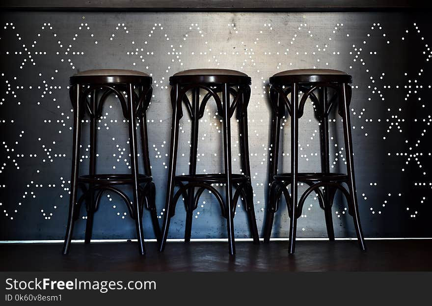 Bar Counter With High Chairs In Cozy Restaurant