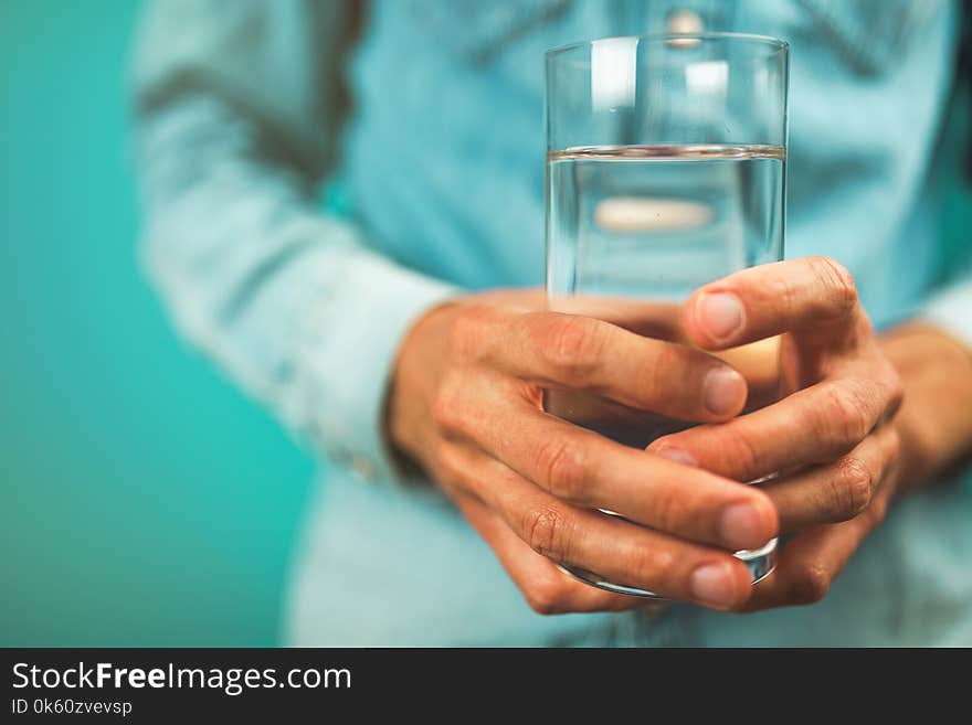 Man holding a glass of water