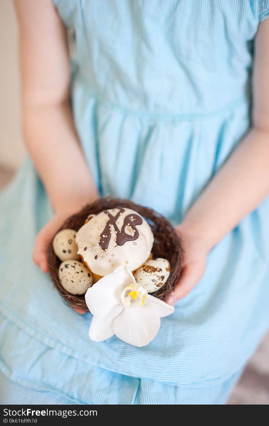 The Girl Is Holding The Easter Decor