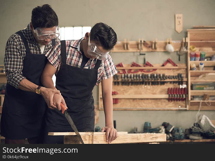 Father and son in workshop