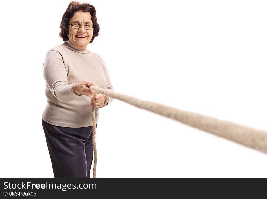 Elderly woman pulling a rope isolated on white background