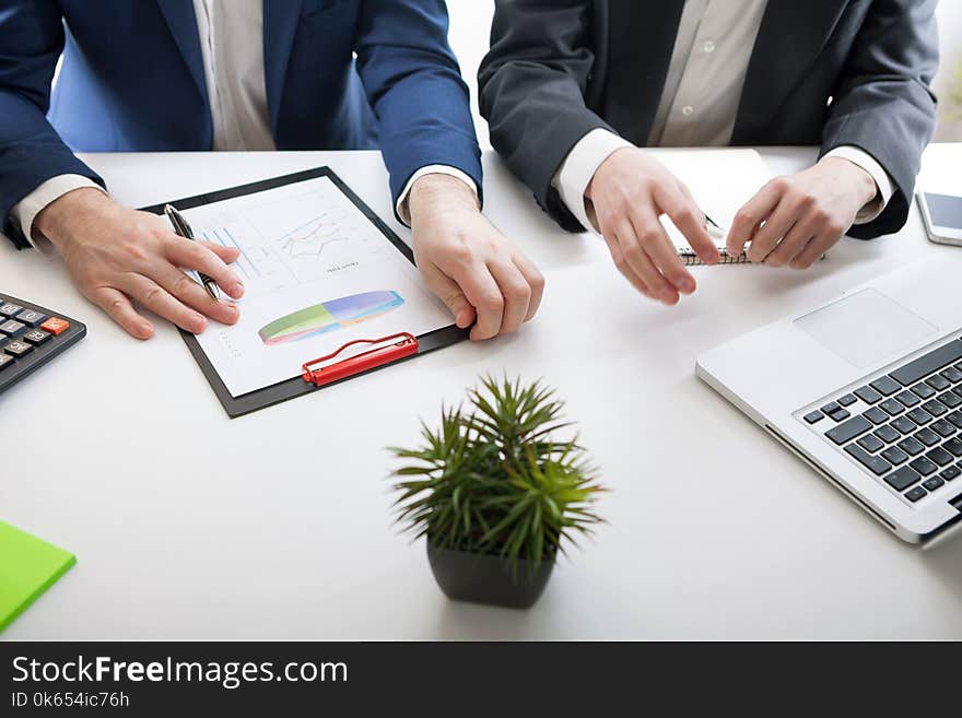 Team job. Hand closeup photo young businessmans crew working with new startup project. Team job. Hand closeup photo young businessmans crew working with new startup project