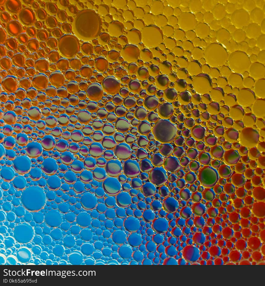 Water oil emulsion to make abstract images using colored backgrounds. Water oil emulsion to make abstract images using colored backgrounds