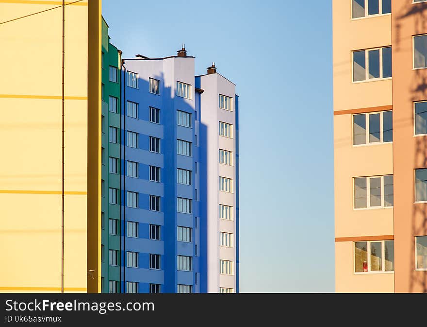 Details of new constructed colorful multi-story building. Modern residential construction. Residential fund