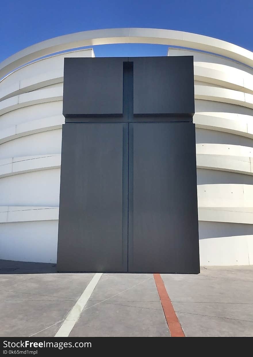 White and Black Concrete Building Under Blue Sky