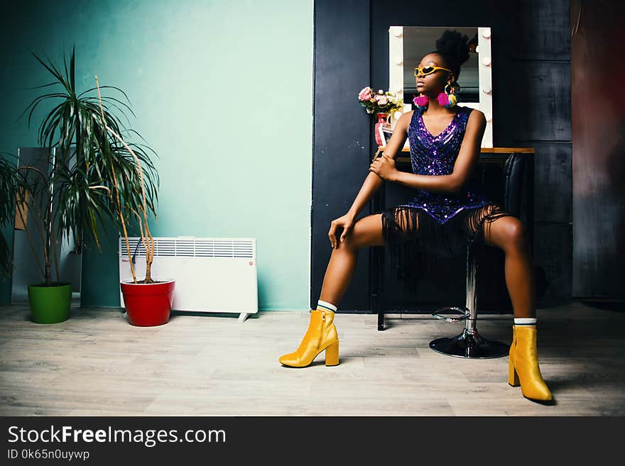 Woman in Black Bottoms and Pair of Yellow Chunky Heels