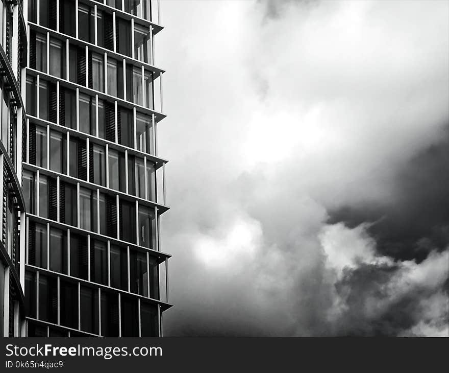 Grayscale Photo of Glass Building