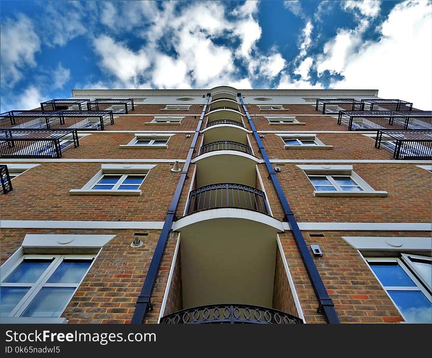 Low Angle Photography of Brown Brick Building