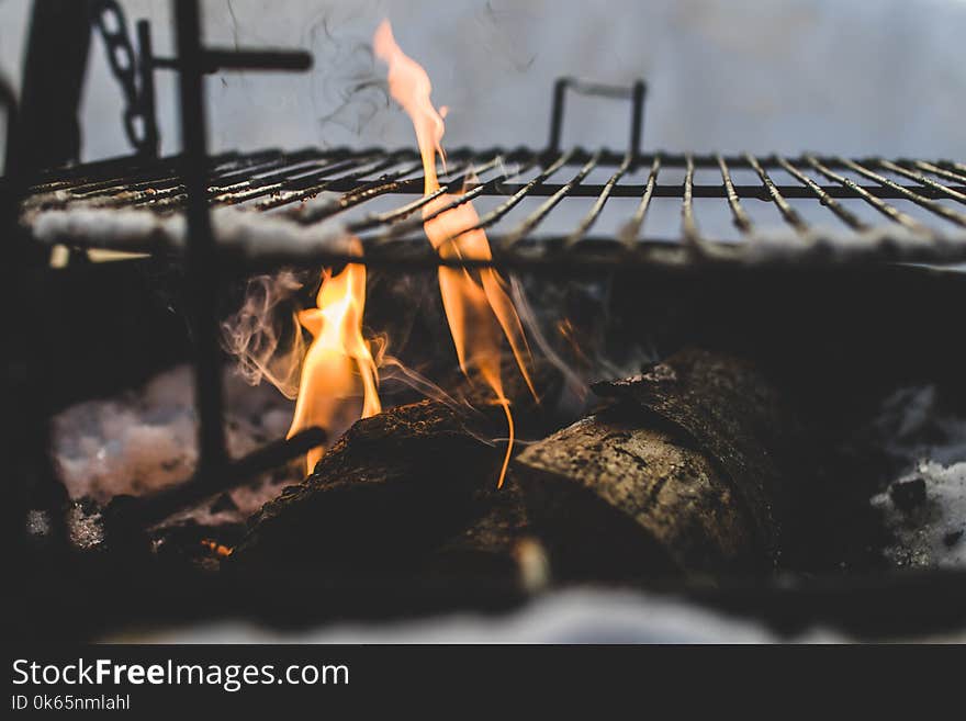 Burning Under Black Metal Grill