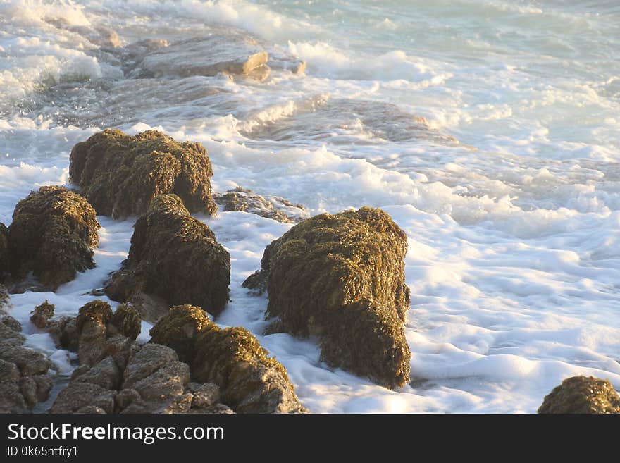 Rock Formation Near Body of Water