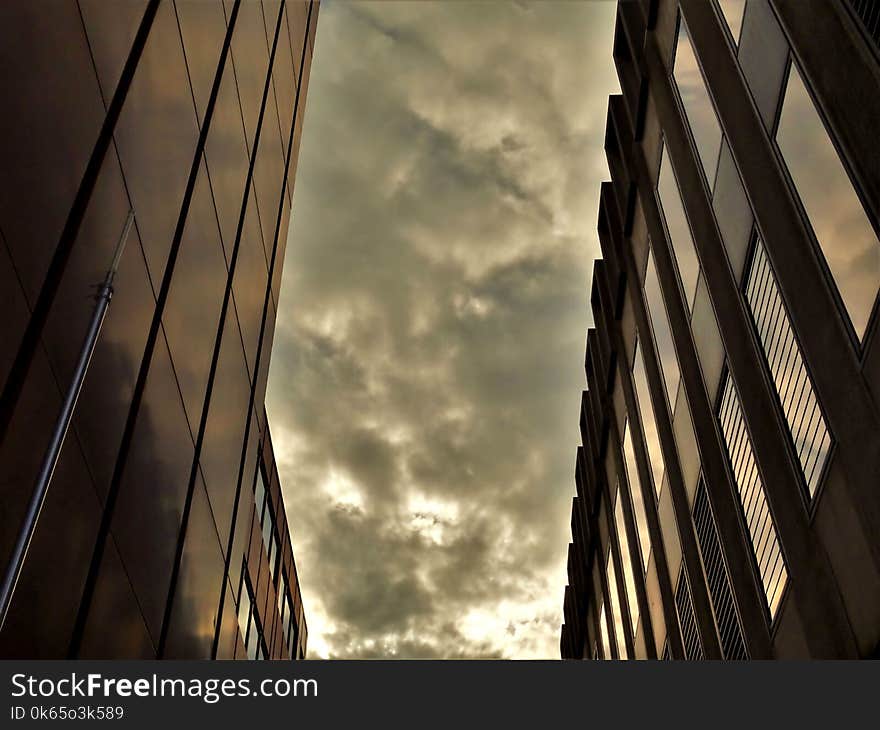 Two Black High-rise Buildings Under Gray Cloudy Sky