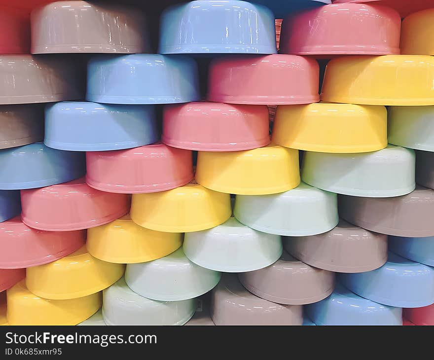 Full Frame Background of Staggered Colorful Plastic Bowls