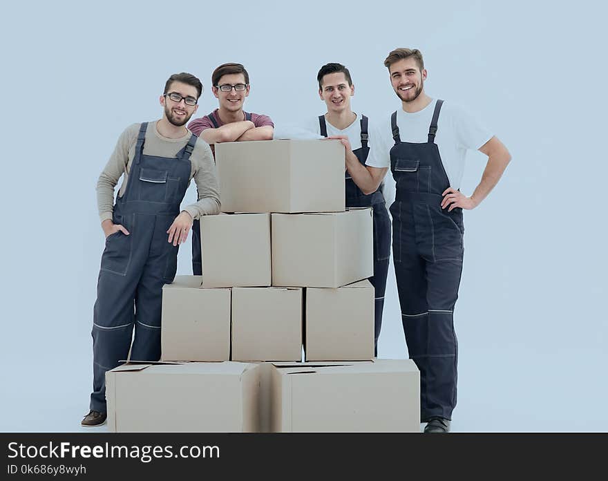 Men holding pile of carton boxes on white background. Men holding pile of carton boxes on white background